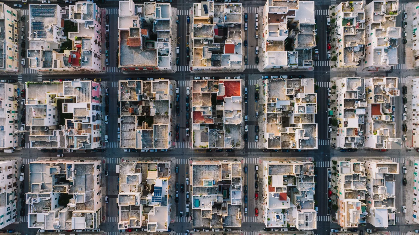 Rooftops of a city grid seen straight from above