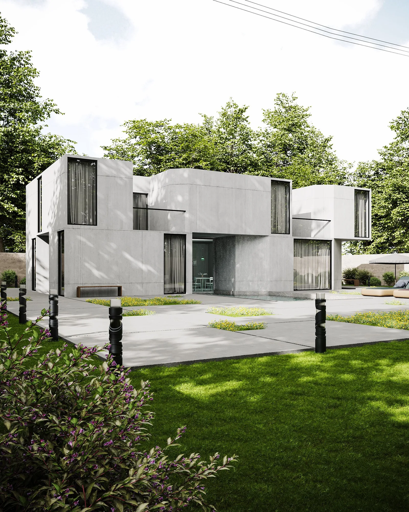 A concrete villa with a lawn and young trees