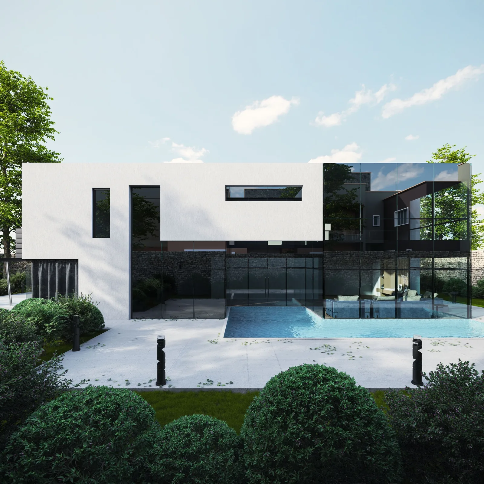 A white villa with a dark glass ground floor and a garden